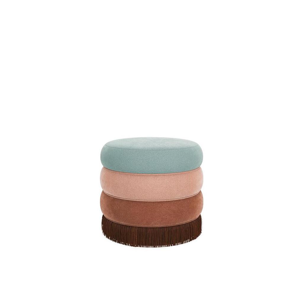 A small Audrey stool by Ottiu featuring a three-tier upholstered velvet body in mint green, dusty rose, and terracotta, finished with a long chocolate brown fringe base.