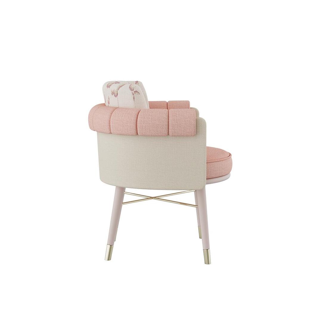 Helen dining chair shown in profile, dressed in plain wool fabric by Dedar with a patterned weave, supported by white lacquered wood legs and embellished with polished brass accents.