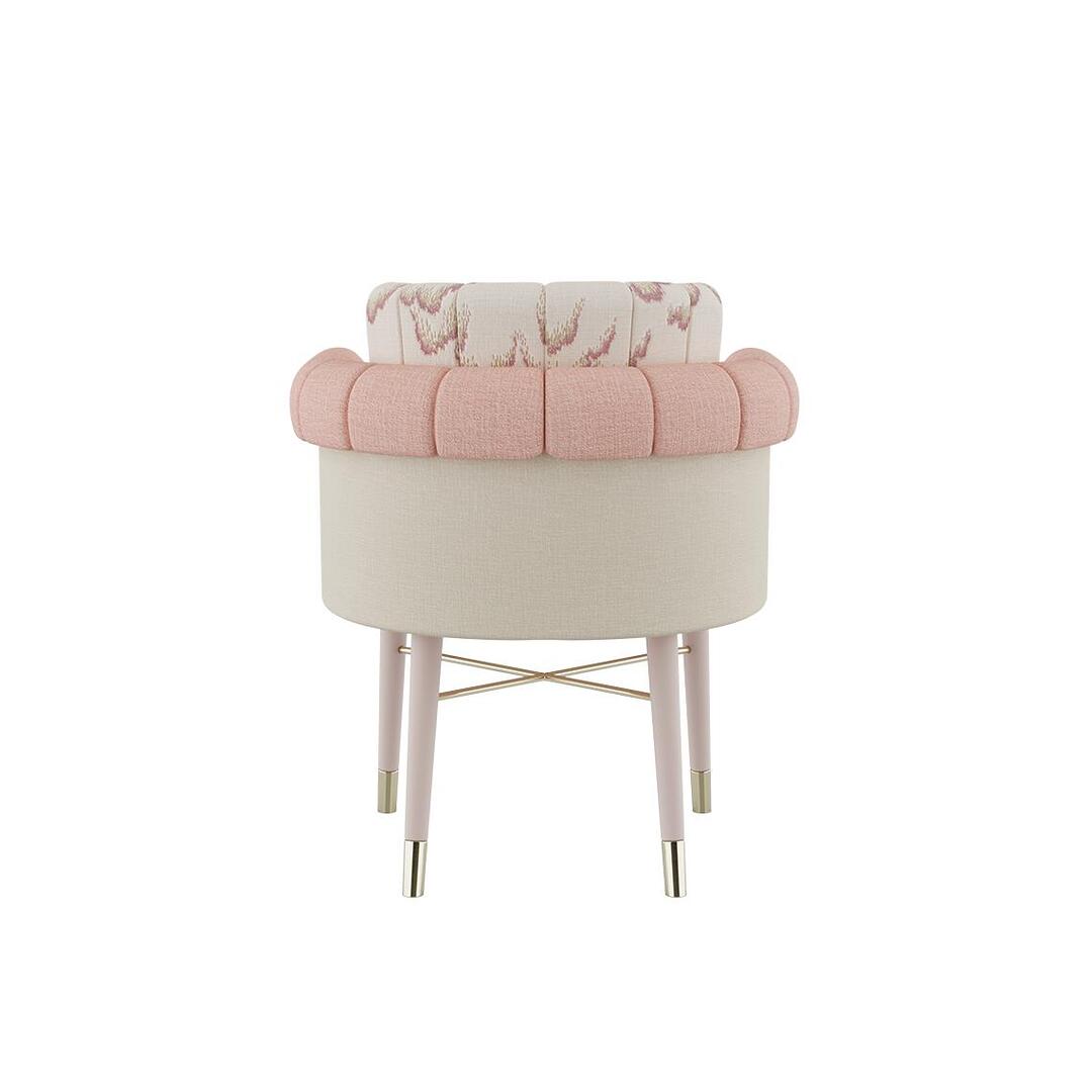 Helen dining chair shown from the back, dressed in plain wool fabric by Dedar with a patterned weave, supported by white lacquered wood legs and embellished with polished brass accents.