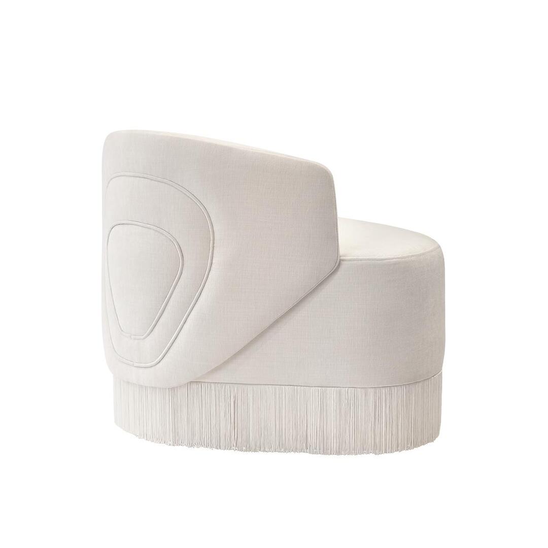 White Doris Armchair in chenille with tricotine fringes, shown from the back at a 45-degree angle on a white background.