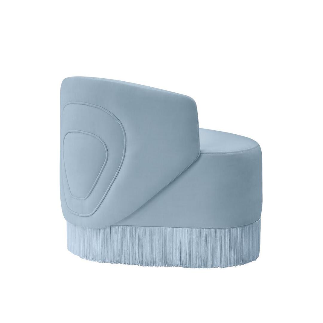 Blue Doris Armchair in chenille with tricotine fringes, shown from the back at a 45-degree angle on a white background.