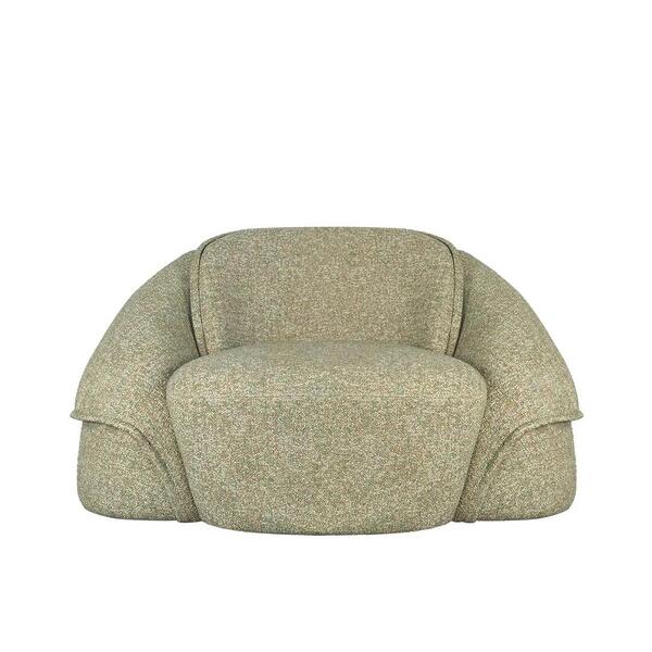 Front view of the Romy armchair by Ottiu, showcasing its symmetrical, sculptural design. The chair is fully upholstered in Lierna fabric by Casamance, featuring a textured, multi-tonal weave in earthy green and beige. It has a rounded backrest, a deep plush seat, and distinctive wide, enveloping armrests with a layered, folded aesthetic.