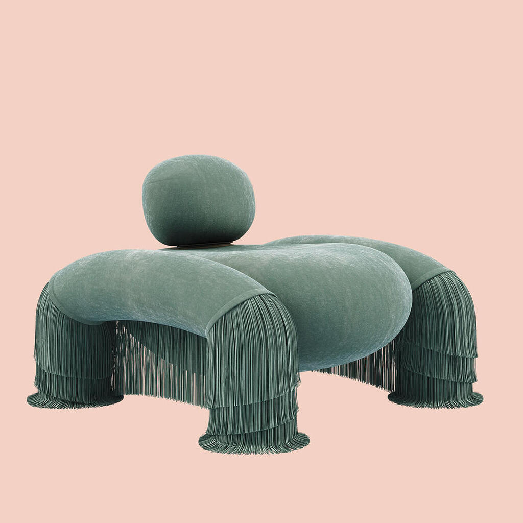 45-degree front view of the Odessa Armchair with backrest pulled-up and fringes, upholstered in Dedar Plushy 147 and Sirgaria Castro Seda 111, paired with aged brass.
