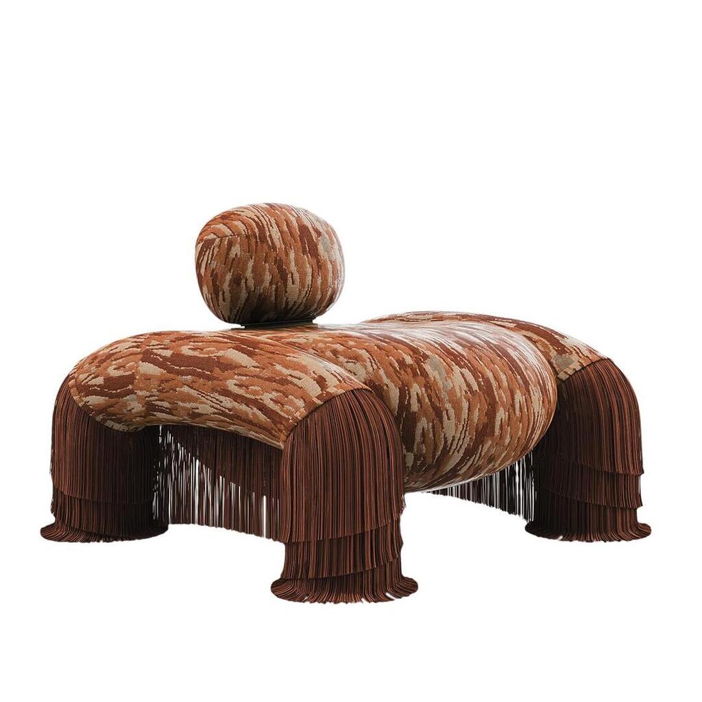 Odessa armchair at a 45-degree angle, upholstered in Bomarzo 003 fabric with abstract forest pattern on neo-tapestry jacquard and Bordeaux fringes