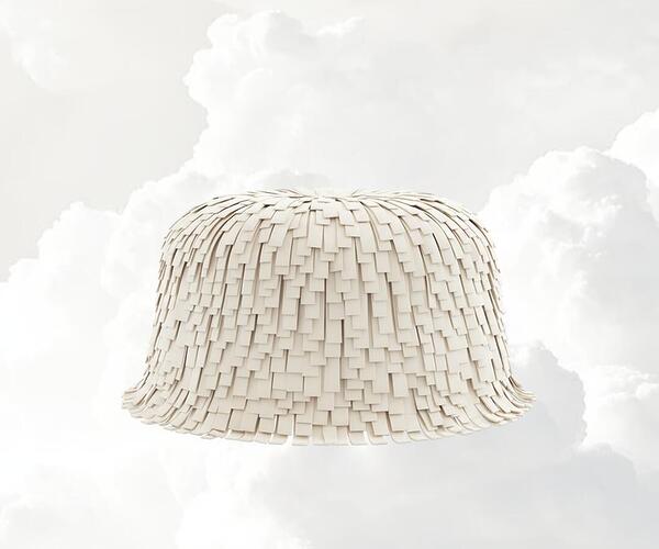 Lyra Ottoman with fringes, upholstered in the new Pantone Color of the Year Cloud Dancer, set against a soft cloud background.