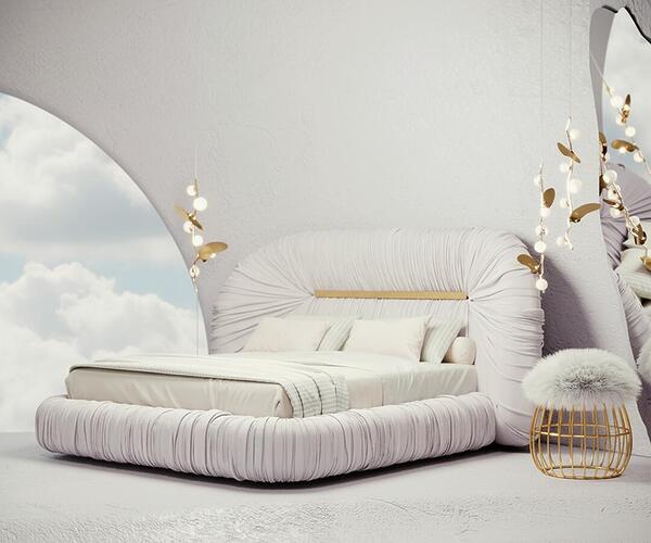 Tammi bed upholstered in Cloud Dancer within a dreamy, cloud-filled interior, accompanied by the Andy Stool and Almond pendant lamps.