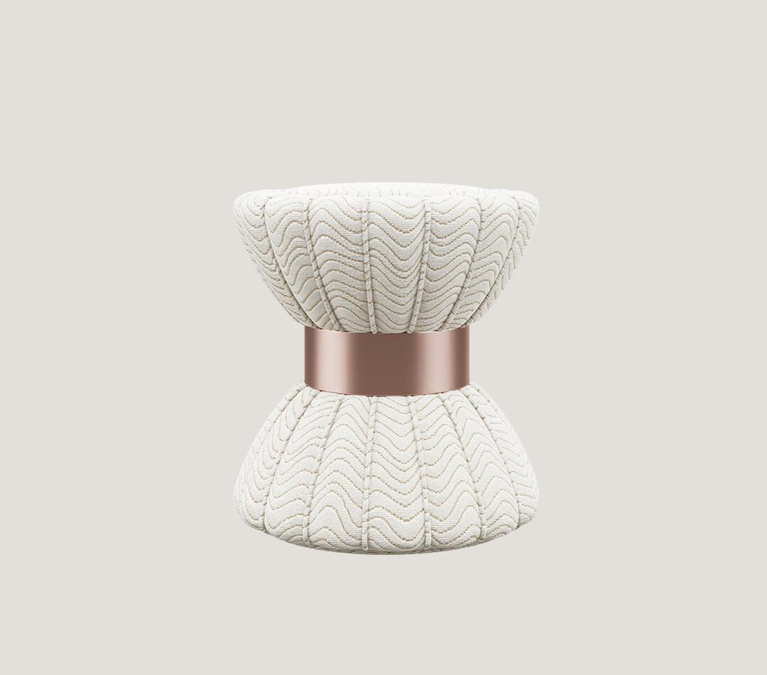 Colette Stool upholstered in a patterned fabric featuring the new Pantone 2026 color Cloud Dancer, accented with a copper ring.