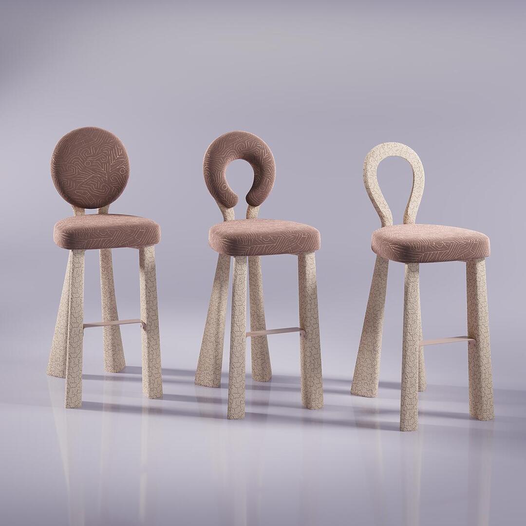 A group shot of three Mary Bar Chairs displayed side-by-side from a front three-quarter angle. The image showcases the product's versatility, featuring the fully upholstered back (left), the open-back version with a velvet ring (center), and the minimalist version where the entire back structure is upholstered in bouclé (right).