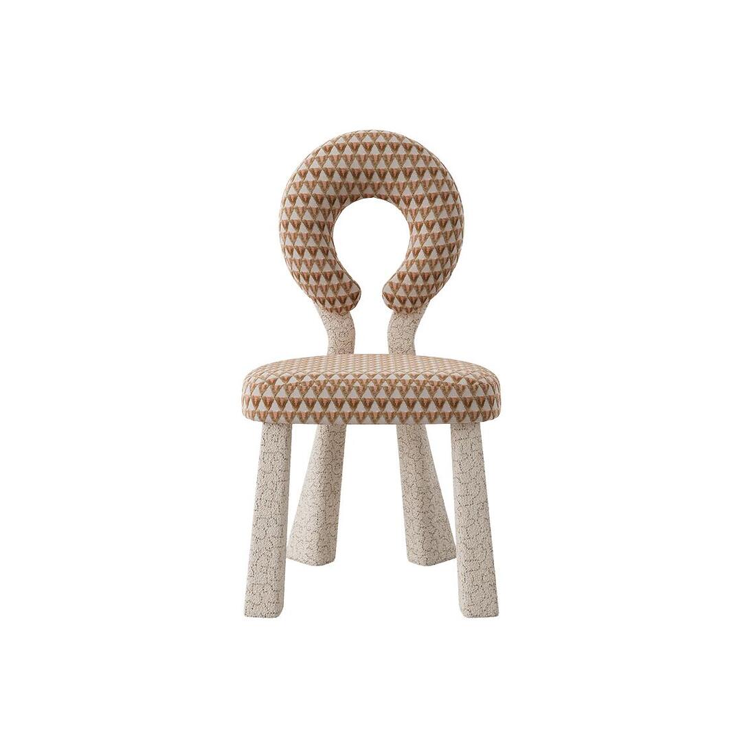 Frontal view of the Mary Dining Chair, displaying the symmetrical circular backrest and the textured bouclé legs.