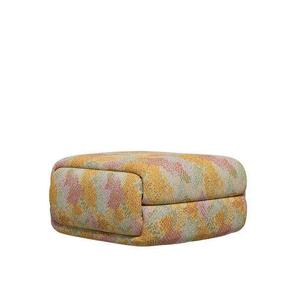 The Elsa Ottoman, a voluminous, square pouf featuring a distinctive two-tiered, pillowy design. It is fully upholstered in a textured fabric with a vibrant, geometric mosaic pattern in warm shades of yellow, coral, peach, and sage green.