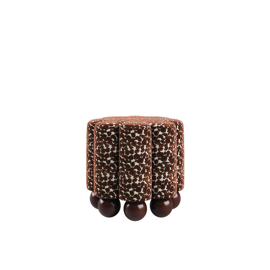 Front view of the Myrna Stool featuring a series of tailored vertical tubes upholstered in Misia Niki patterned velvet, supported by a base of solid lacquered wood spheres.