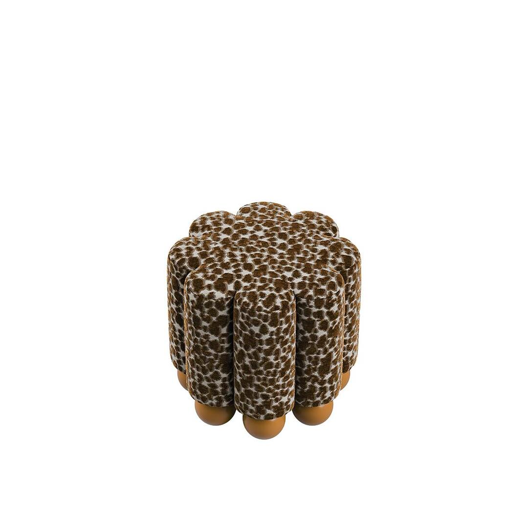 High-angle view of the Myrna Stool, highlighting the rhythmic texture of the vertical pleats and the modern, avant-garde silhouette.