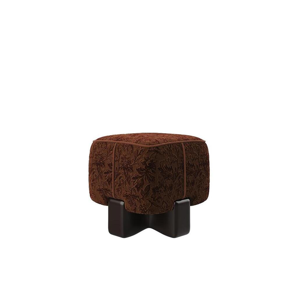 A front view of the Pola Stool featuring deep terracotta-colored velvet upholstery with a rich botanical pattern and a dark, glossy cross-shaped base.
