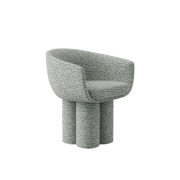 A three-quarter front view of the Mae Dining Chair, demonstrating its curved shape and the plush, rounded seat. The "Pierre Frey - Le chant des dunes - Aqua" fabric pattern is clearly visible across the entire structure.