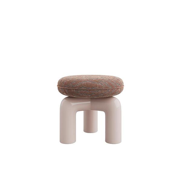 Straight-on eye-level view of the Tamara Stool by Ottiu. The stool displays a rounded, thick seat in a rich brown velvet fabric detailed with dark, rippling embroidered textures. The smooth, shiny base consists of bold, tubular arches in a soft, pale pink lacquered wood finish, creating a modern, architectural look.