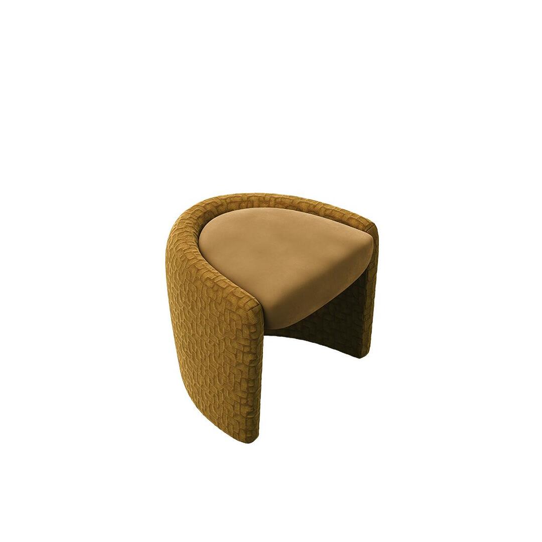 High-angle top view of the ochre-gold Grace Stool by Ottiu, emphasizing its organic, semi-circular silhouette and the smooth texture of the crescent-shaped suede seat surrounded by a pattern-engraved velvet frame.
