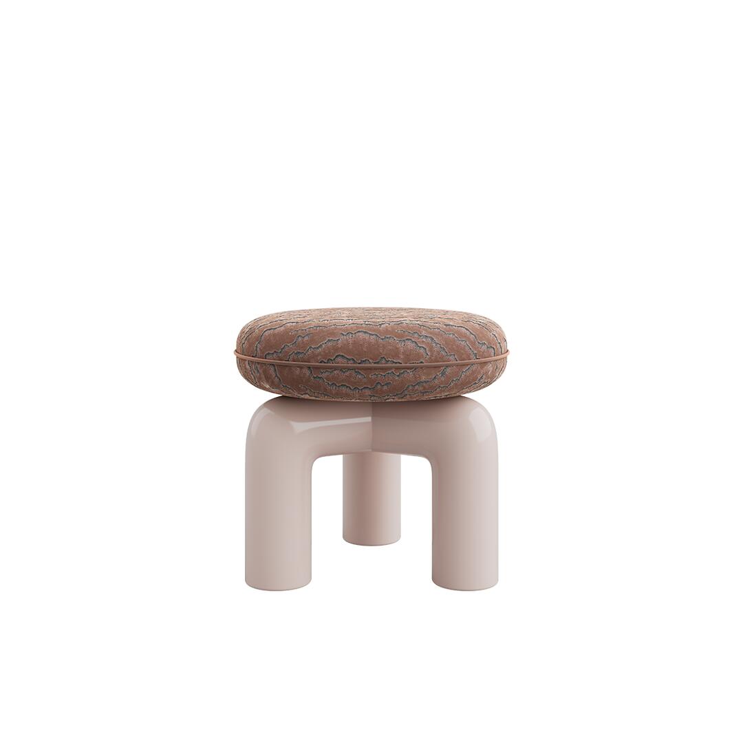 Straight-on eye-level view of the Tamara Stool by Ottiu. The stool displays a rounded, thick seat in a rich brown velvet fabric detailed with dark, rippling embroidered textures. The smooth, shiny base consists of bold, tubular arches in a soft, pale pink lacquered wood finish, creating a modern, architectural look.