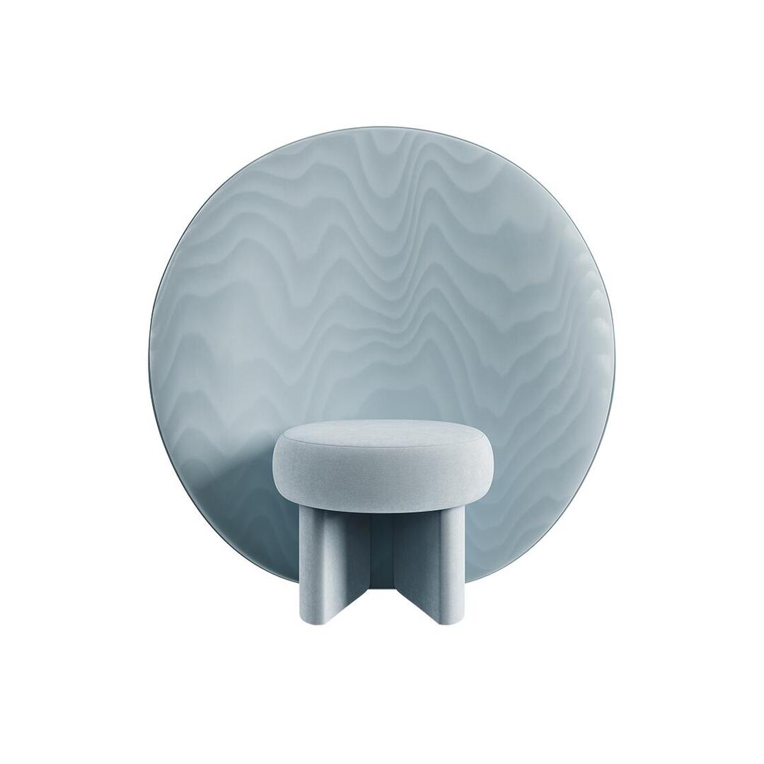 Front view of the Solène Armchair in light ice-blue velvet, featuring a small round upholstered seat supported by two thick, geometric upholstered legs. The oversized, perfectly circular backrest features a textured Moiré Libre fabric with subtle wavy, water-like patterns.