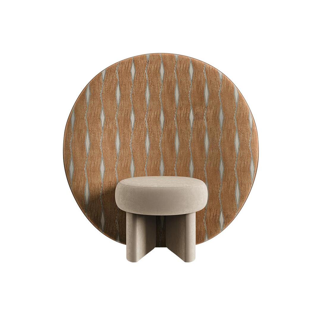 Front view of the Solène Armchair by Ottiu, showcasing a minimalist taupe velvet round seat. Behind it stands the large circular back panel, upholstered in a graphic fabric with a vertical zigzag and diamond geometric pattern in terracotta orange and cream.