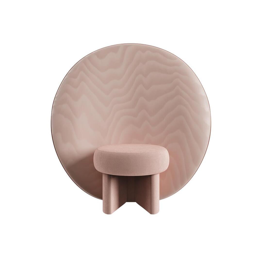 Front view of the Solène Armchair in a soft, dusty rose pink. The thick, geometric upholstered legs support a round velvet seat, framed by the large circular backrest covered in wave-textured Moiré Libre fabric.