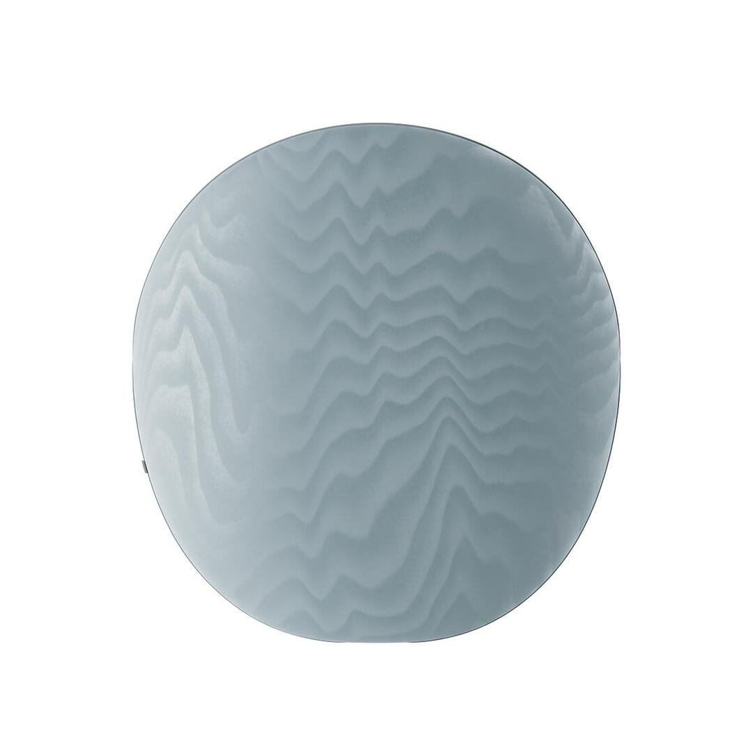 Direct back view of the Solène Armchair, showcasing the perfect circle shape of the large backrest upholstered in ice-blue Moiré Libre fabric with its characteristic fluid, rippling texture.