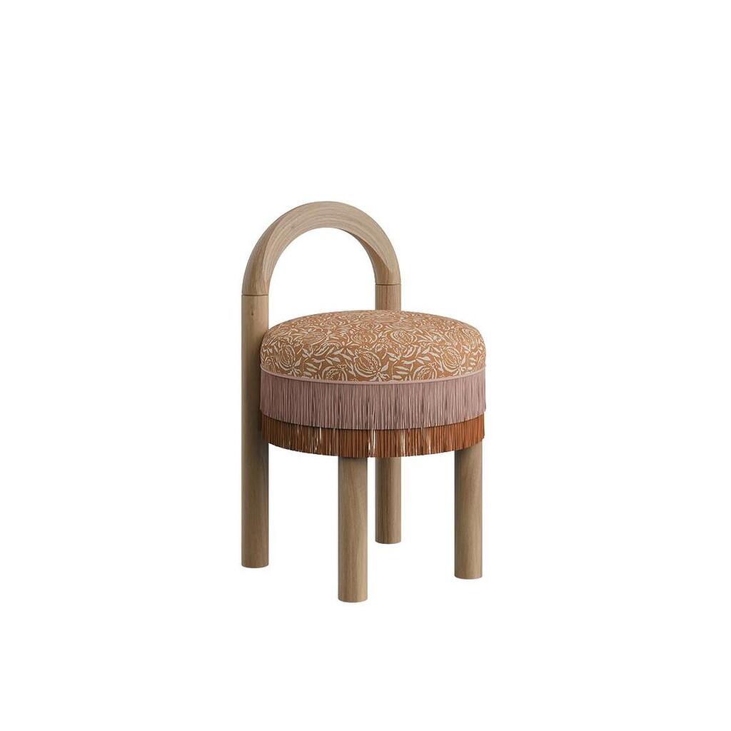 Side-angle view of the Ann dining chair in natural wood, featuring a round cushioned seat with decorative weave fabric and dual-tone fringes.